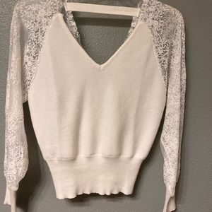 Boutique white sweater with lace arms and back. Size small, but fits loosely.